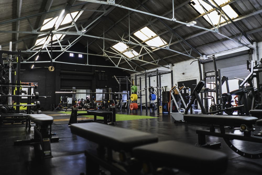 A CrossFit gym is a fitness facility that specialises in CrossFit training and exercise. CrossFit is an exercise programme that incorporates weightlifting, high-intensity interval training, gymnastics, and bodyweight movements. It employs several pieces of equipment, such as pull-up bars, dumbbells, medicine balls, kettlebells, rowing machines, and resistance bands, to assist gym-goers in building strength. A CrossFit gym fosters total health, wellbeing, and strength.